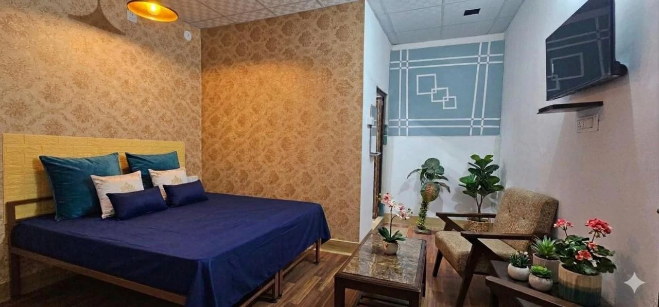 Comfortable bedroom with double bed and TV